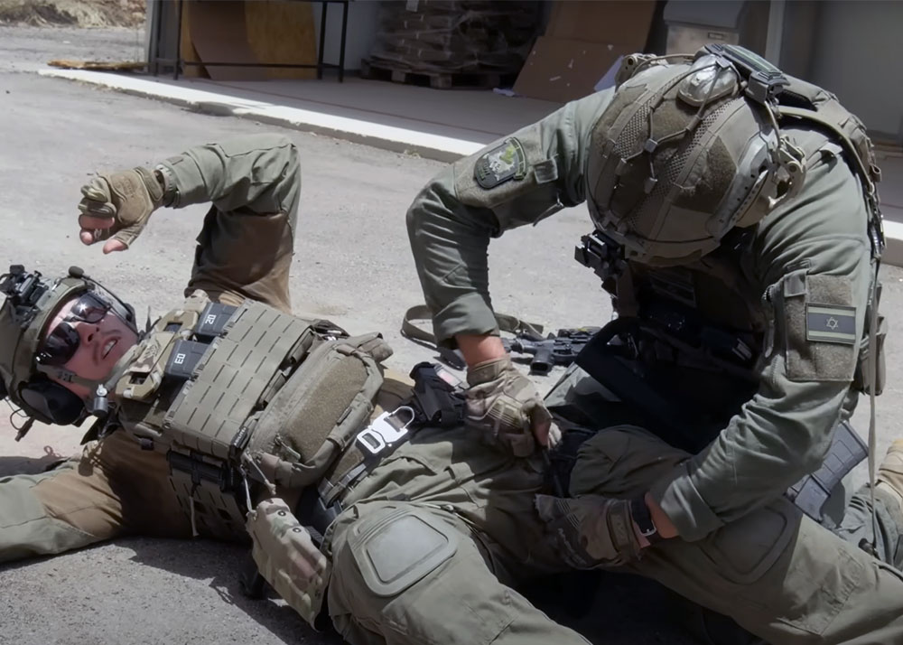 Agilite Gear Giving First Aid While Taking Fire